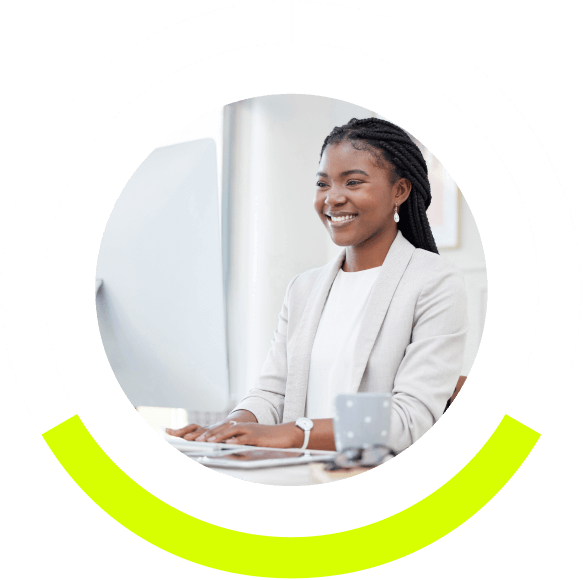 woman working on her computer and smiling