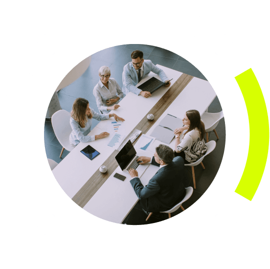 people having a meeting at a large conference table